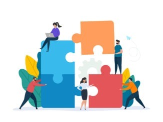 Teamwork concept with building puzzle. People working together with giant puzzle elements.