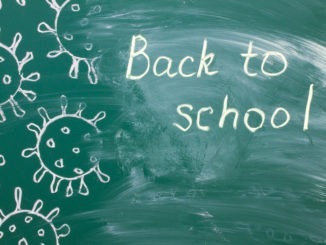 writing on a green chalkboard – back to school