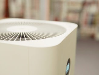 Closeup DOF of indoor air purifier in bedroom, air pollution PM 2.5, air quality, respiratory health concept