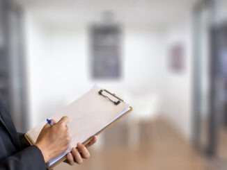 man business inspection Notepad with pencil on wood board background.using wallpaper for education, business photo.Take note of the product for book with paper and concept, object or copy space.