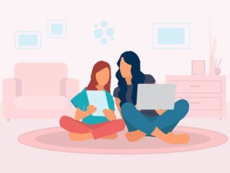 Mother teaching her daughter at home in living room, learning with laptop and digital tablet