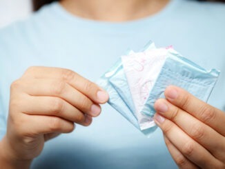 Woman holding sanitary pads