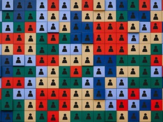 concept of diversity. A large number of colored cubes with icons depicting people.