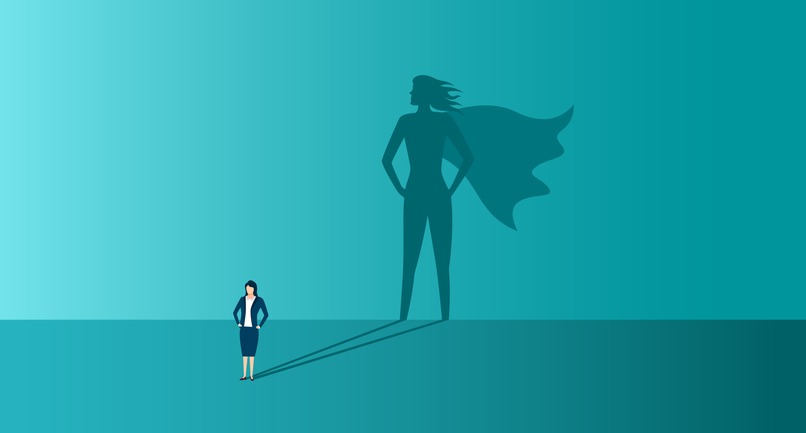 Businesswoman with shadow of superhero. Concept of power, leadership and confident.