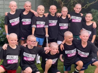 Thirteen schoolboys shave heads to support friend