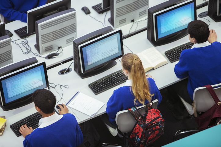 view of students sitting and learning in computer room
