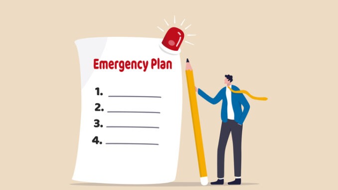 Business emergency plan, checklist to do when disaster happen to continue business and build resilience concept, smart businessman leader holding pencil with paper of emergency plan flashing siren.