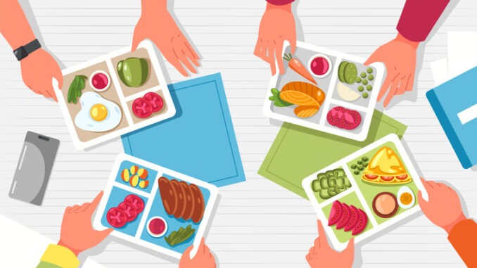 Hands with lunchbox. Arms holding containers with healthy food on table top view