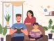 Happy family people reading books, sitting on sofa in cozy home living room