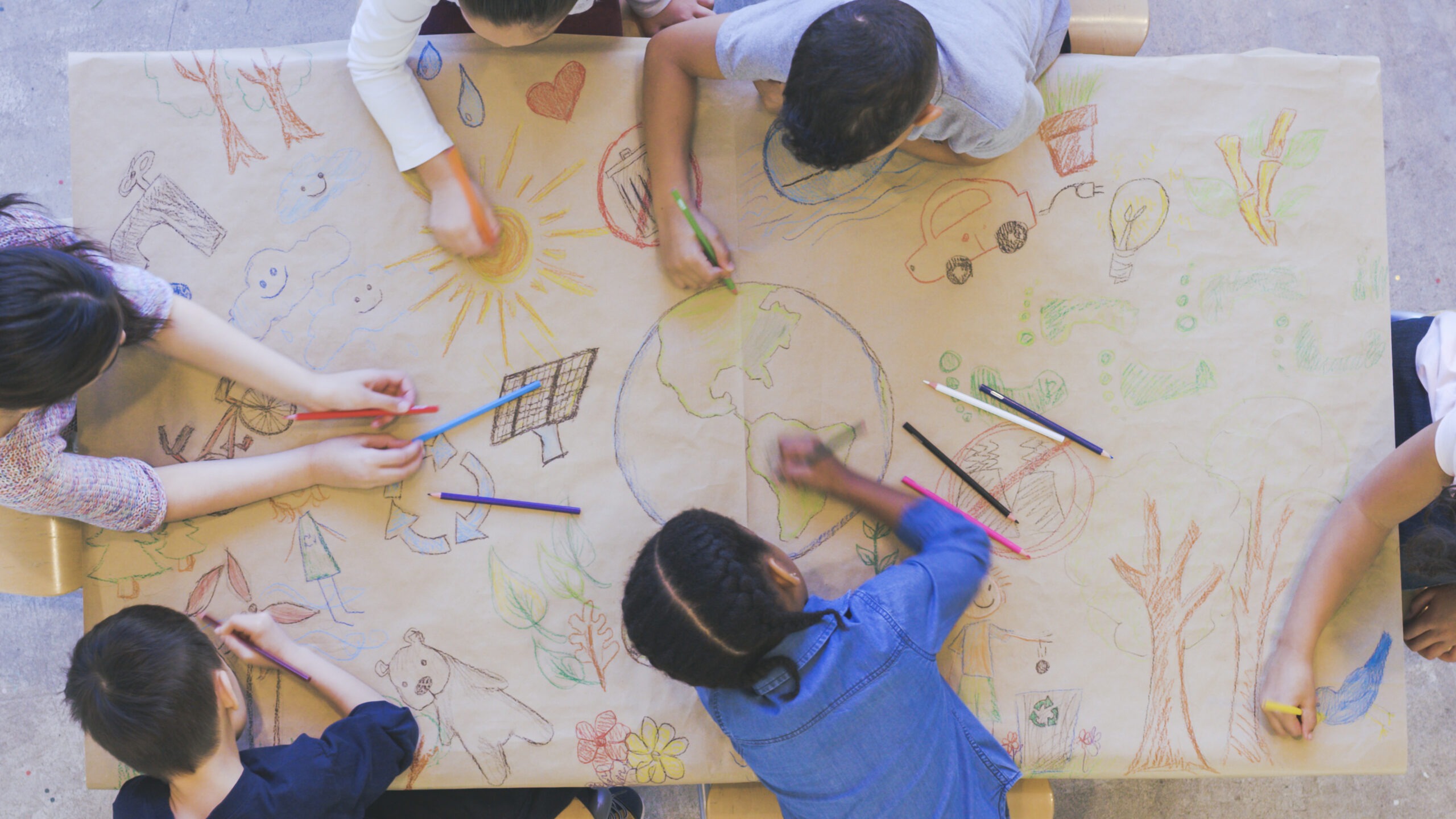 Group of children color environmentally conscious mural