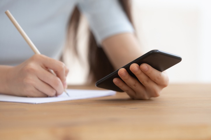 Closeup image schoolgirl writing helpful info use online app websites