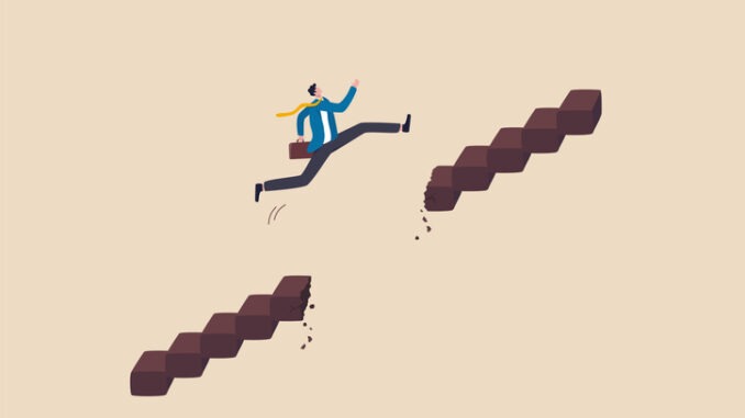  challenge and risk to success and win business competition concept, ambitious businessman jump pass broken stair gap to reach target.