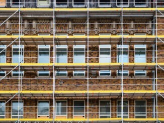 Floors of scaffolding for renovation works on art-deco brick building in the style of the Amsterdam School. Taken in Utrecht, the Netherlands.