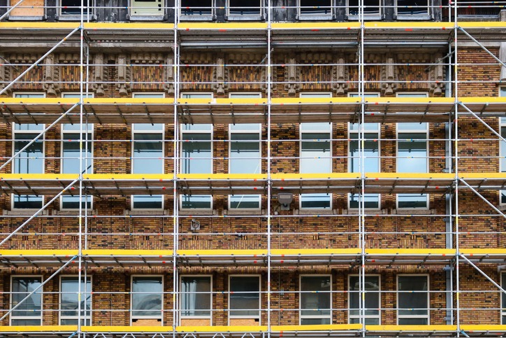 Floors of scaffolding for renovation works on art-deco brick building in the style of the Amsterdam School. Taken in Utrecht, the Netherlands.