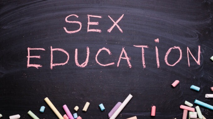 The word sex education written in chalk