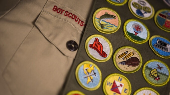 Merit badges on Boy Scout uniform