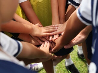group of young people's hands