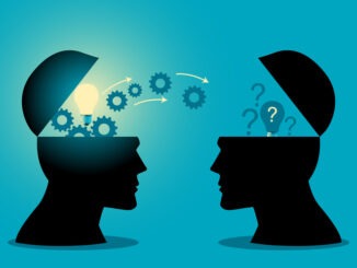 Knowledge or ideas sharing between two people head,