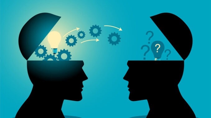 Knowledge or ideas sharing between two people head, 