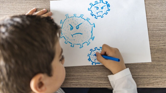 Little kid drawing a coronavirus