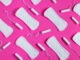 Tampons, feminine sanitary pads pattern on pink background. Hygiene care during critical days. Menstrual cycle. Caring for women's health. Monthly protection.