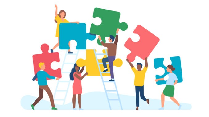 Tiny people with puzzle. Men and women collect large color puzzle pieces, office teamwork, work optimization, common affair, business teambuilding, 