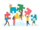 Tiny people with puzzle. Men and women collect large color puzzle pieces, office teamwork, work optimization, common affair, business teambuilding,