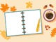 Autumn background with open empty pages of notebook,