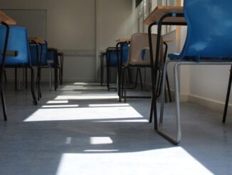 Low angled view of an empty classroom with sunlight