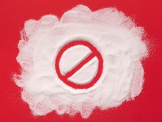 Sugar on a red background with a banned sign