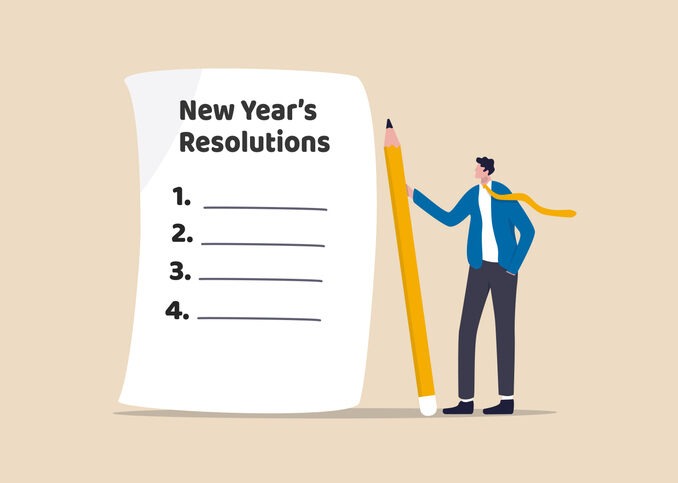 New year's resolutions, set goal or business target for new year or beginning with work challenge concept, smart businessman holding big pencil thinking about new year's resolution on notepad paper.