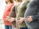 Pregnant women lined up in a row