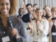 Group of people applauding after speech during conference