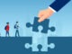 Vector of a teacher hand holding puzzle piece bridging the gap