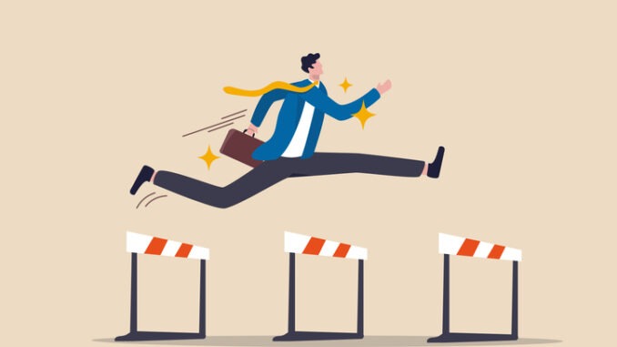 Success to win in business competition, overcome obstacles or motivation to solve problem and lead company achievement concept, confident businessman leader jump high over 3 hurdles to be winner.
