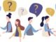 Group of people talking. People around question marks. Question answer metaphor