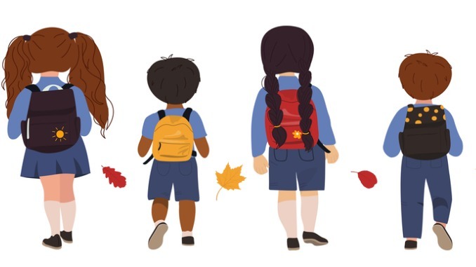 Back view pupils in uniform going to school