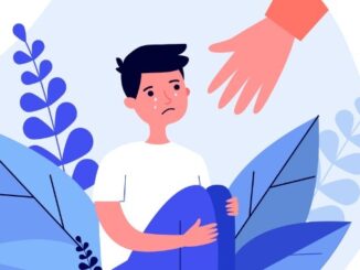 Helping hand for crying school boy