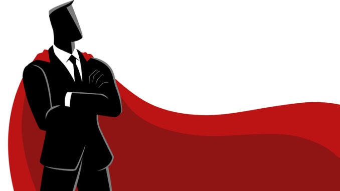 Businessman as a superhero, wearing a magnificent red cape 