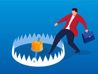 Businessman carefully enters mouse trap