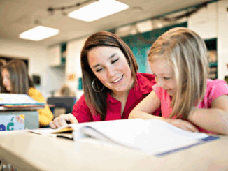 Teacher helping child with schoolwork