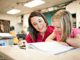 Teacher helping child with schoolwork