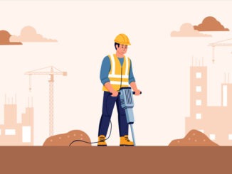 male worker using jack hammer with safety uniform at under construction site