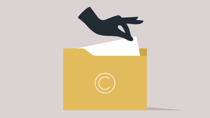Intellectual property fraud, A hand stealing a sheet of paper from a folder with a big copyright sign