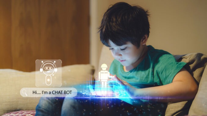Education Technology Learning concept,Kid using CHAT BOT building robot game on tablet with notification face icon pop up,Boy programming Robot with exposure screen web surfing,cyber diagram interface