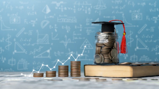 Students for College and University Tuition, Tuition for Education, Investment and Scholarships. stack of coins on a book with a graph and a graduation cap
