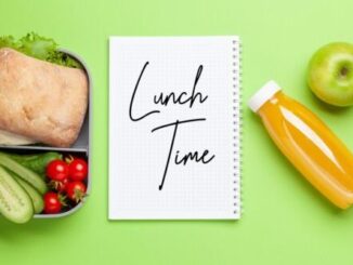 Lunch box with sandwich, vegetables and juice. School or office meal. Flat lay with copy space