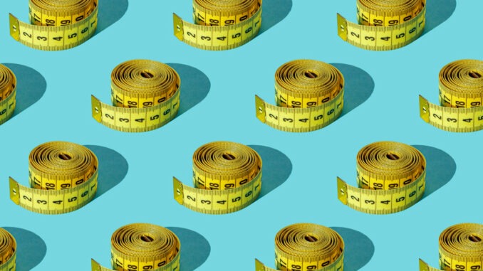 Yellow measuring tape on a green background. Set. Texture.
