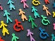 Colorful figurines on the dark surface. Diversity and inclusion concept.