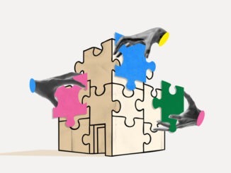 Several hands fit colorful puzzle pieces into the shape of a building on a light background. Concept of team collaboration, organizational development, integration and planning
